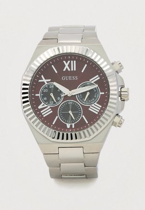 Stainless steel wristwatch with a burgundy dial, silver accents, Roman numerals, three subdials, and a textured bezel.