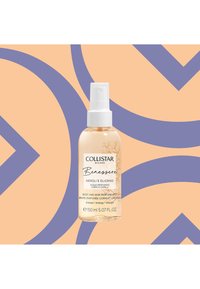 Brume corporelle et capillaire Collistar dans une bouteille cylindrique transparente avec un spray blanc. Liquide transparent, étiqueté "Neroli e Elixiro."