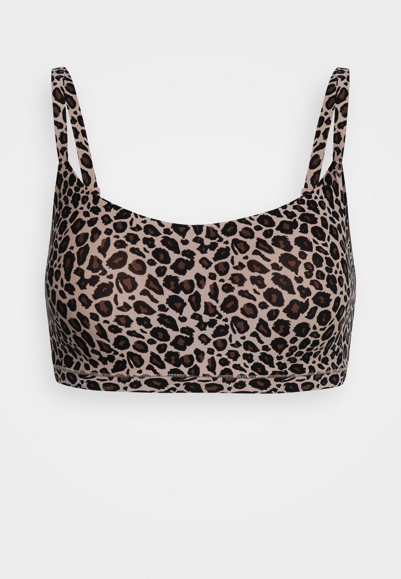 Leopardprint bralette met dunne bandjes. Gemaakt van zacht materiaal, met een beige achtergrond en donkere bruine vlekken. Naadloze randen.