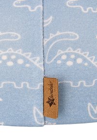 Light blue fabric featuring a dinosaur pattern in white, with a stitched seam and a brown leather label marked "Sterntaler."