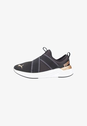 Black athletic slip-on shoe with mesh upper, elastic straps, white sole, and a gold accent on the heel. Non-slip rubber outsole.