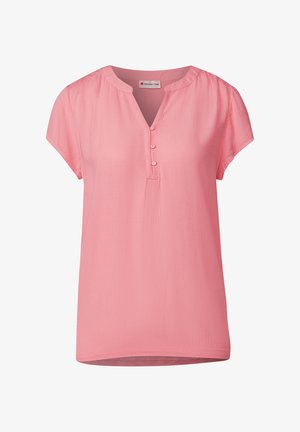 Blouse rose à manches courtes avec un col rond, doté d'une patte de boutonnage et d'un tissu doux et texturé avec une coupe décontractée.