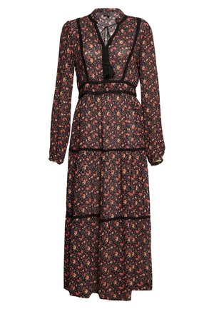Longue robe noire fleurie avec manches longues, jupe à volants, bordure en dentelle noire et détail pompon à nouer au col.