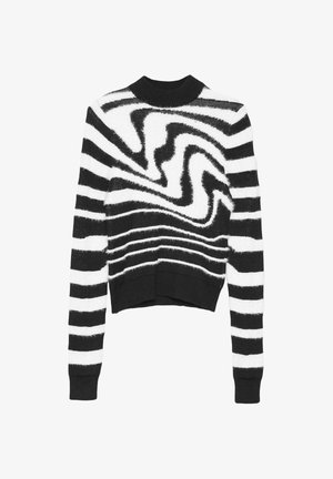 Jersey recortado de rayas en blanco y negro, confeccionado en punto suave y texturizado, con un escote redondo y patrones horizontales y ondulados en contraste.