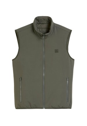 Bez rękawów kamizelka w oliwkowym kolorze, wykonana z miękkiego materiału. Posiada wysoki kołnierz oraz dwie boczne kieszenie na zamek. Gładka tekstura, minimalistyczny design.