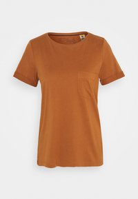 Kortærmet t-shirt i rustfarve lavet af blødt stof, med rund halsudskæring og en lille brystlomme til venstre samt opkrabbede ærmer.