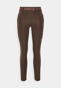 Leggings Nike Pro marroni con un design aderente, dotati di una vita alta con logo, tasche laterali e materiale liscio e elastico.