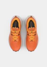 Orange athletic shoes with a textured upper, yellow accents, and a cushioned sole. Feature laces and a reinforced toe cap for support.