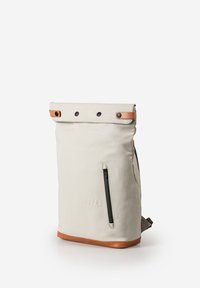 Off-white roll-top backpack with brown leather accents, front vertical zipper pocket, and embossed "a/u" logo, standing upright on white background.