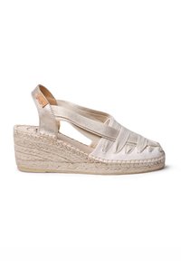 Espadrille wedge sandal with cream canvas upper, crisscross straps, and jute-wrapped heel. Features a flat rubber sole.