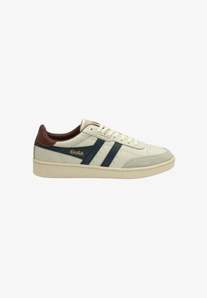 White leather sneakers featuring navy blue and light grey stripes, brown accents on the heel, with a textured finish and cream sole.