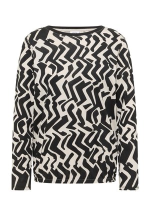 Camisa de manga larga en blanco y negro con un patrón abstracto de zigzag en una tela suave, con cuello redondo y ajuste holgado.