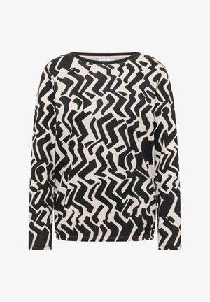 Musta-valkoinen pitkähihainen paita, jossa on abstrakti siksak-kuvio pehmeässä kankaassa, pyöreä pääntie ja rento istuvuus.