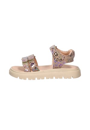Children's beige sandal with thick ridged sole and three adjustable straps featuring iridescent cut-out patterns.