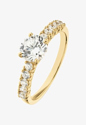 Gelber Goldring mit einem runden, brillantgeschliffenen Zentraldiamanten und sechs kleineren Diamanten, die im Verlauf des Rings gesetzt sind und deren Funkeln betonen.