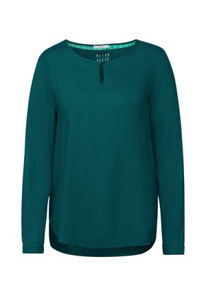 Blusa a maniche lunghe color teal con scollatura rotonda e dettaglio a chiave sul davanti, caratterizzata da un motivo testurizzato e un orlo curvo.