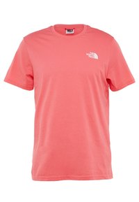 Short-sleeve, crew-neck T-shirt in coral pink cotton, featuring a small white logo on the left chest. Smooth texture, relaxed fit.