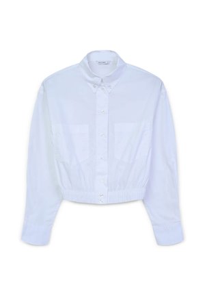 Camicia bianca cropped con bottoni, colletto, due tasche frontali e orlo elasticizzato. Tessuto liscio con una texture semplice e senza fantasie.