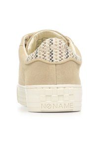 Beige suede sneaker with woven accent at the collar, cushioned inner lining, and a white rubber platform sole featuring a checkerboard pattern.