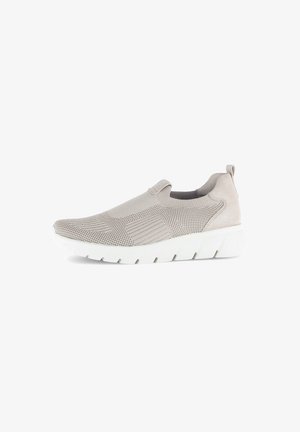 Slip-on sneakers featuring a light beige knit upper with textured patterns and a cushioned white rubber sole. Soft fabric pull tab at heel.