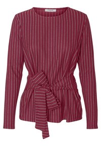 Red long-sleeve top with silver vertical stripes, a round neckline, and a tied waist detail, featuring a textured, soft fabric.
