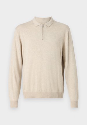 Beige long-sleeve pullover with a collared neckline and zip closure. Made of soft material with ribbed cuffs and hem.