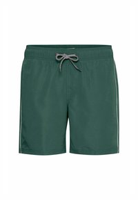 Pantaloni da bagno verdi con chiusura a coulisse, caratterizzati da una texture liscia e una striscia bianca a contrasto lungo i lati.