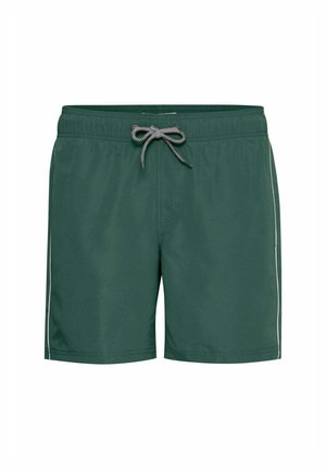 Pantaloni da bagno verdi con chiusura a coulisse, caratterizzati da una texture liscia e una striscia bianca a contrasto lungo i lati.