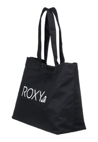 Černá plátěná taška na rameno s dvojitými popruhy, obdélníkovým tvarem a výrazným bílým logem "ROXY" na přední straně.