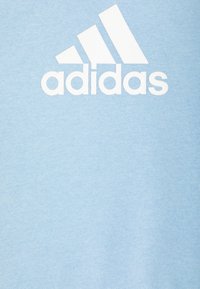 adidas Performance BADGE OF SPORT - Tuta - clear sky/white