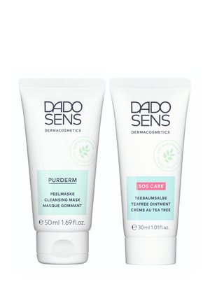Two white tubes of DADO SENS dermacosmetics: left is PURDERM cleansing mask (50 ml), right is SOS CARE tea tree ointment (30 ml).