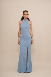 Light blue, form-fitting halter dress with a high neckline, side slit, and smooth texture; floor-length design with minimal hardware accents.