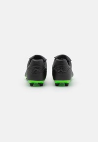 Lotto STADIO - Jalkapallokengät kiinteälle alustalle - all black/spring green