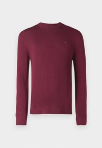 Burgundski pulover s dolgimi rokavi, okrogłym izrezom, rebrastimi manšetami in obrobkom. Ima majhen logo na prsih, pletena tekstura.