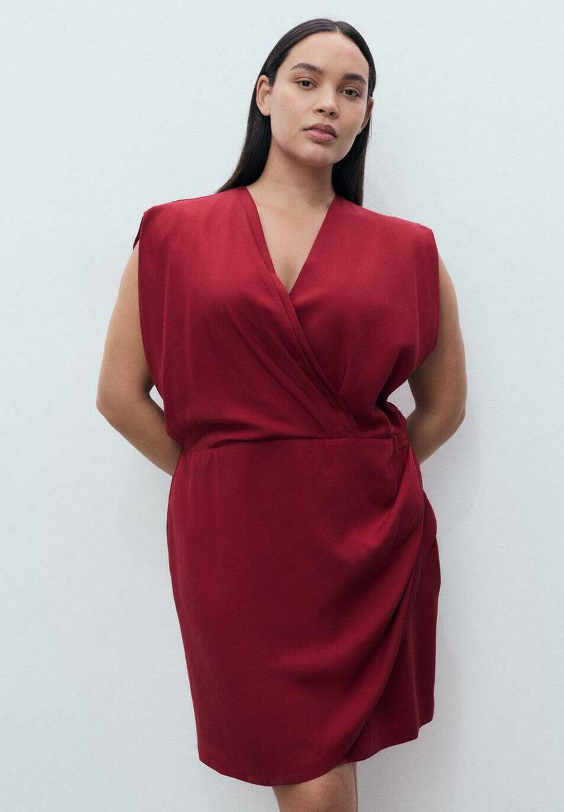 Red wrap dress with short sleeves, soft fabric, V-neckline, draped design, and a fitted waist creating a smooth silhouette.