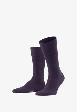 Lila Baumwollsocken mit einem gerippten Bündchen und glatter Textur, ausgestattet mit einer verstärkten Fußspitze und Ferse. Logo seitlich angebracht.