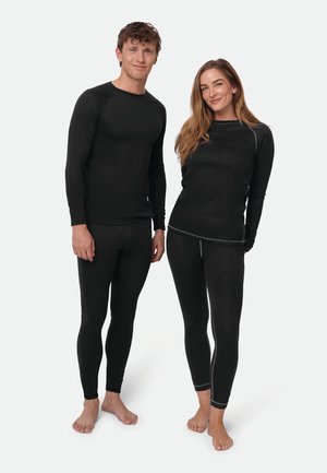 Schwarzes thermisches Basisschicht-Set, Langarmshirt und Leggings, dehnbarer Stoff, figurbetontes Design, kontrastierende graue Nähte, weiche Textur.