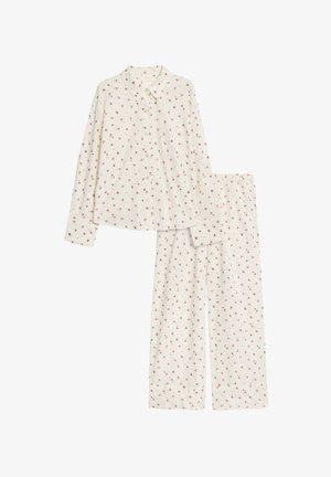 Set di pigiama in cotone composto da una camicia a maniche lunghe con bottoni e pantaloni, entrambi con una base crema e un piccolo motivo floreale in rosa e verde.