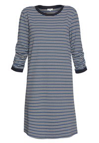 Robe bleu marine avec un col rond et des manches trois-quarts, présentant un motif géométrique de points bleus et blancs, texture de tissu douce.