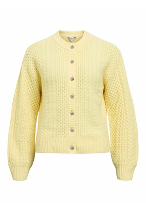 Kollane kudumist kardigan tekstuurse mustriga, ümara kaelusega ja kuue dekoratiivse nööbiga ees. Soonilised varrukaservad ja ääris.
