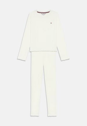 Long-sleeve white top and matching pants loungewear set with small logo on chest and subtle ribbed edges on sleeves and pant legs.