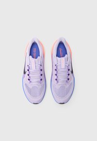 Light purple athletic shoes with mesh upper, black accent, lavender laces, and orange heel detail. Styled for running with cushioned sole.