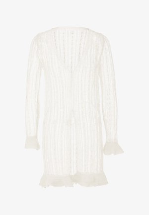 Bílý pletený cardigan s hlubokým V-výstřihem, vertikálními pruhy a volánkovými manžetami. Lehké, strukturované tkaniny, otevřený design vpředu, až po kolena.