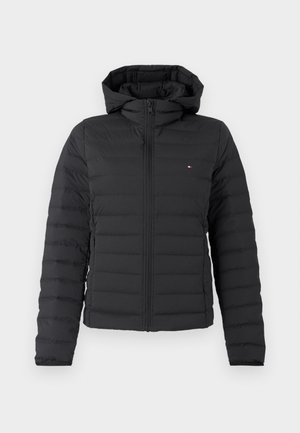 Black puffer jacket with a zip closure and hood, featuring a quilted design and subtle logo accent on the chest. Smooth texture.