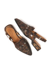Brown leopard print slingback shoes with pointed toe, textured material, decorative silver hardware, and ankle strap. Flat sole.