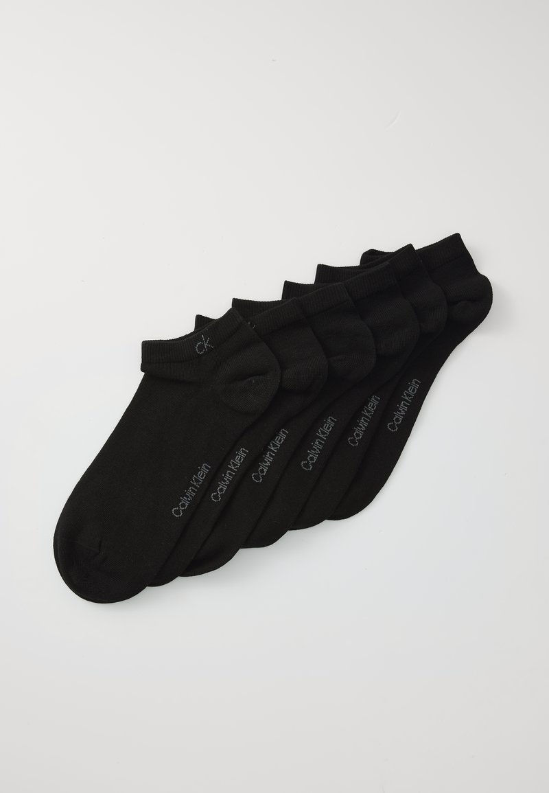 Six pairs of black Calvin Klein ankle socks arranged in a neat row on a white background.