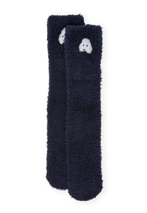 Calzini soffici di colore blu navy con una texture morbida, caratterizzati da una testa di cane bianca ricamata sul risvolto.
