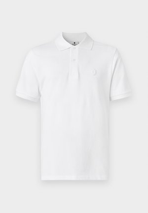 Vit pikétröja i bomull, med klassisk krage, korta ärmar och en diskret logotyp broderad på bröstet.