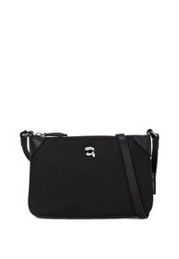 Borsa a tracolla nera realizzata in materiale liscio. Presenta una chiusura con zip, un accento logo argentato e una tracolla regolabile. Forma rettangolare compatta.