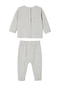Gray cotton two-piece outfit featuring a long-sleeve top with button closure at the back and elastic waist pants with footed design.